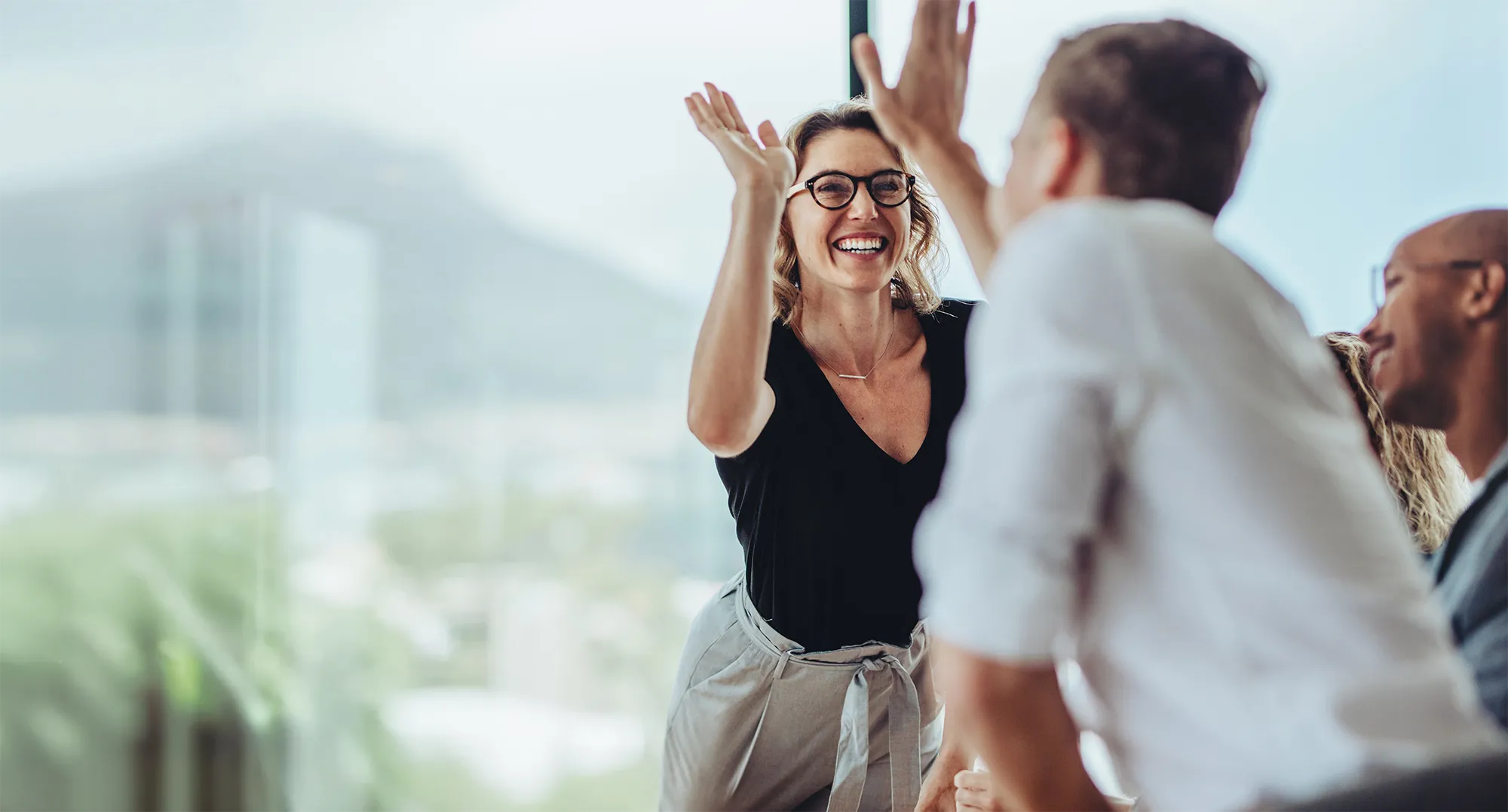 High fiving at office